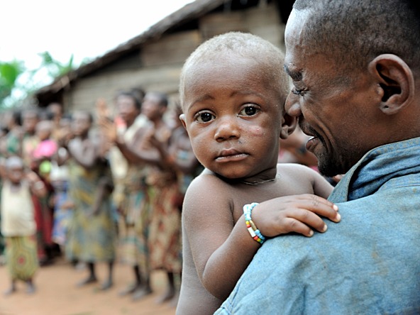 Rural africa father and baby_crop